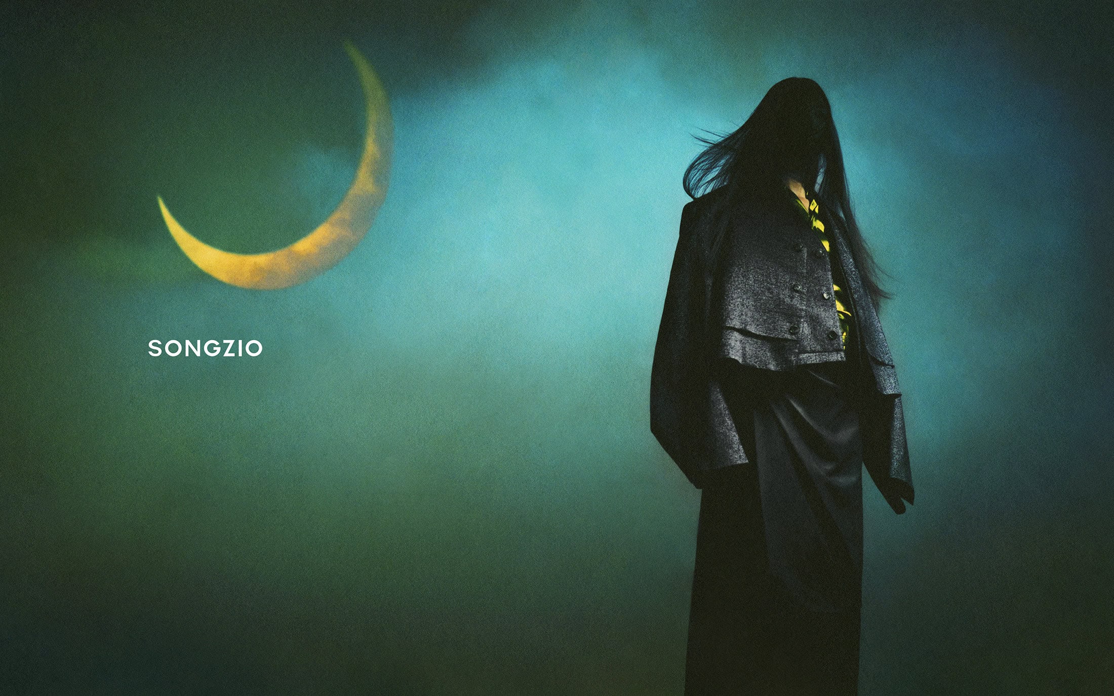 Model with long dark hair wearing a dark jacket against a moody teal background with a yellow crescent moon and brand text