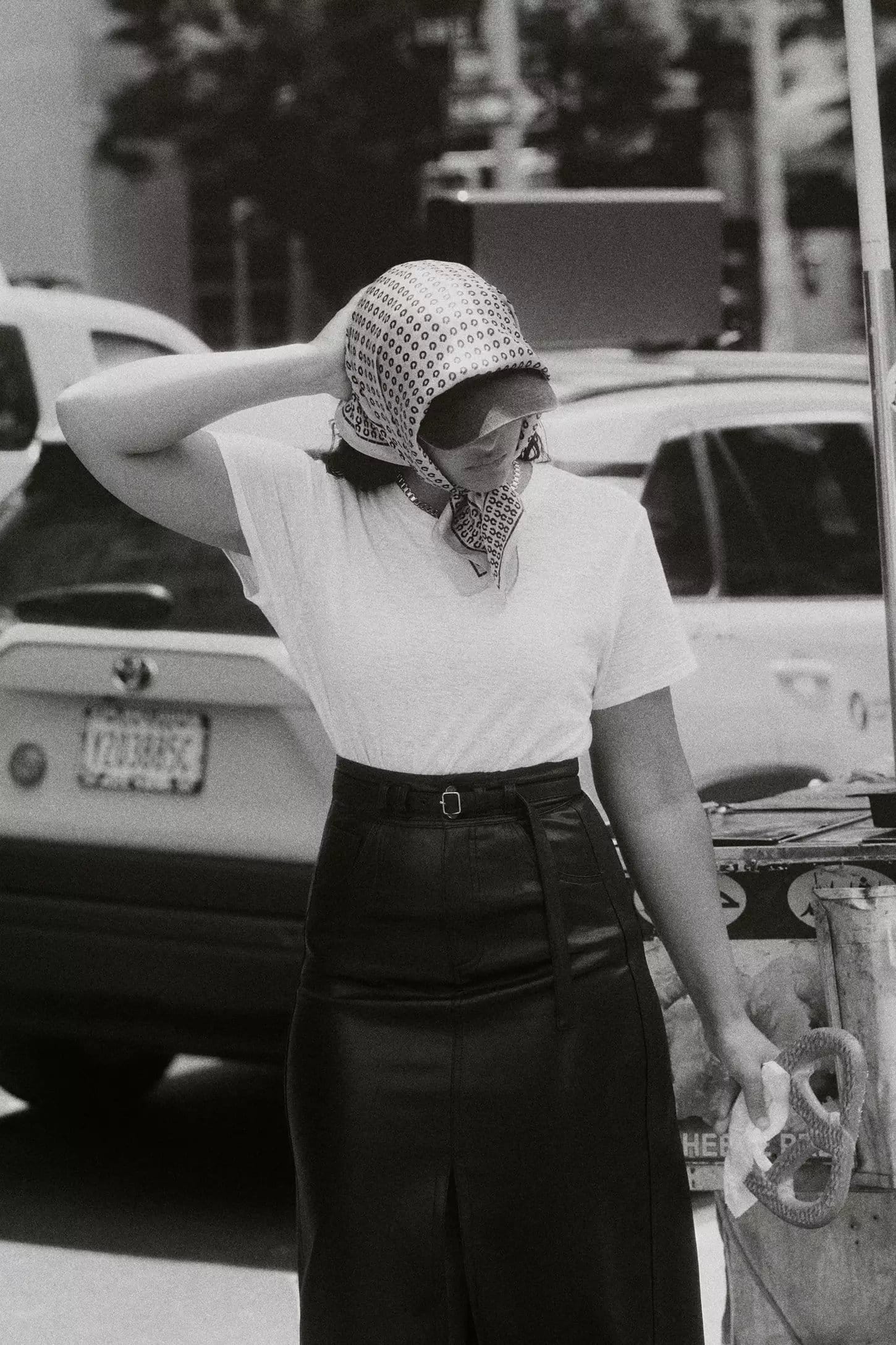 Model wearing a patterned headscarf and dark skirt standing outdoors in New York City for the Anthropologie Fall 2024 Ad Campaign.