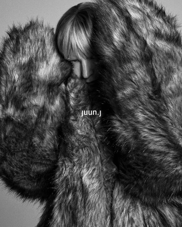 Kirsten Owen in a voluminous faux fur coat for the Juun.J fall 2024 ad campaign photographed by Hong Janghyun.