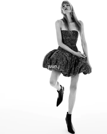 Kirsten Owen in a strapless textured mini dress with black boots against a white backdrop for Juun.J Fall 2024 ad campaign
