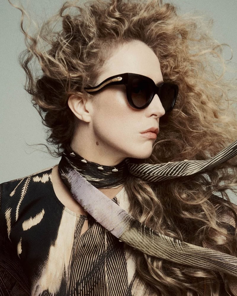 Raquel Zimmermann wearing dark sunglasses and a patterned top in Roberto Cavalli campaign