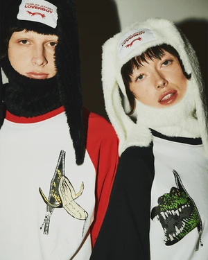 Two models wearing graphic raglan t-shirts and fluffy animal-ear hats by Charles Jeffrey Loverboy.