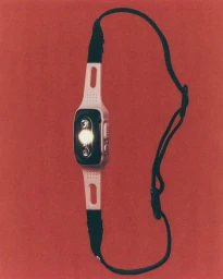 Headlamp with white and black housing and an adjustable black strap displayed vertically on a textured red background