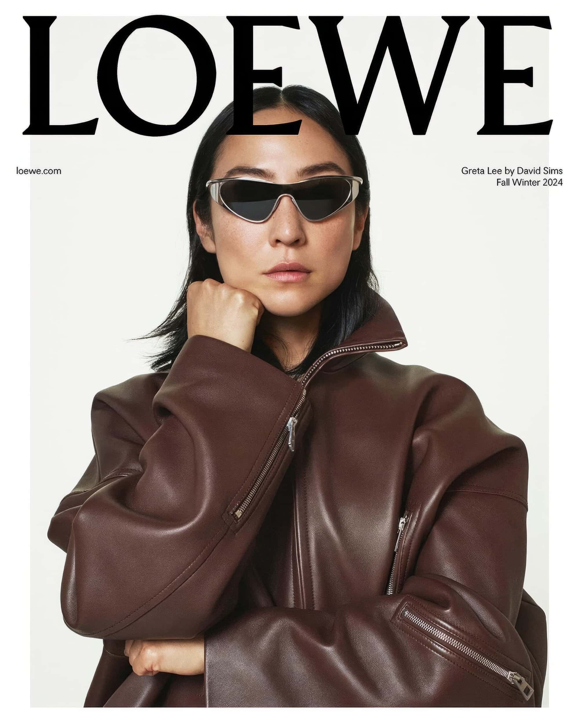 Fashion magazine cover featuring an Asian female model wearing sunglasses and a brown leather jacket on a white background with the brand logo.