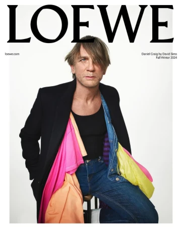Fashion magazine cover featuring Daniel Craig in a black blazer, jeans, and colorful shirts, with the LOEWE logo at the top.