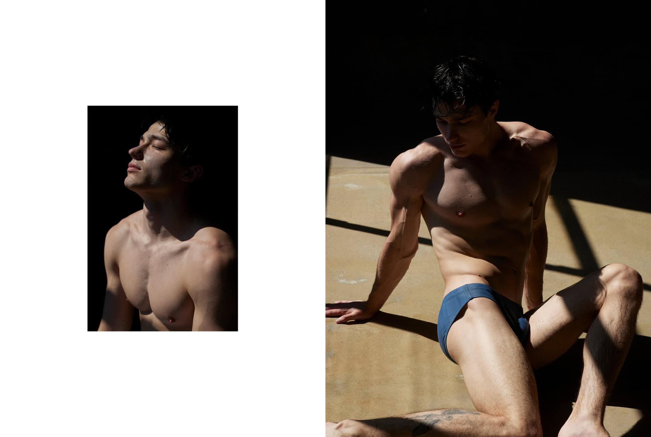 Striking studio portrait of a muscular, shirtless adult male in blue swim trunks, set against a stark contrast of light and shadow.