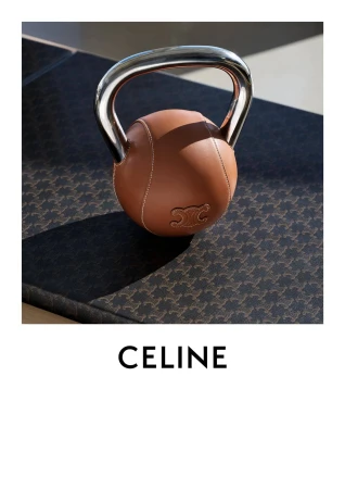 A leather kettlebell with a chrome handle rests on a patterned mat. The brand name CELINE is displayed in bold, sans-serif font.