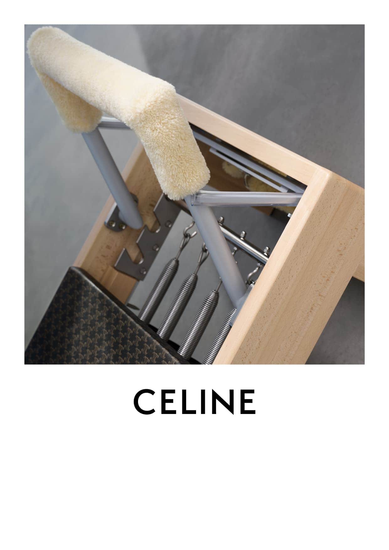 Pilates Wunda Chair equipment featuring a padded headrest, springs, and a wooden frame, suitable for studio fitness.