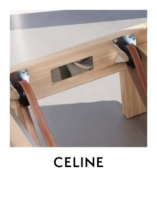 Close-up of light wood chair with brown leather straps, silver hardware, and a gray seat. Branding reads CELINE.