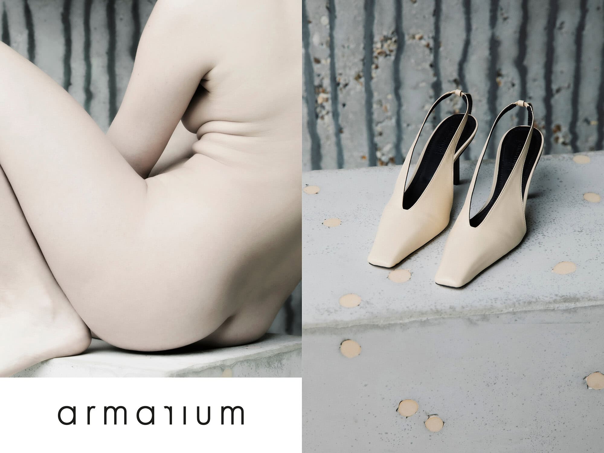 Nude adult female seated next to slingback stiletto heels on concrete surface, set against a textured grey background. Minimalist shoe advertisement.
