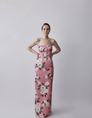 Michelle Dockery in a pink floral strapless gown against a plain grey seamless studio background for Emilia Wickstead