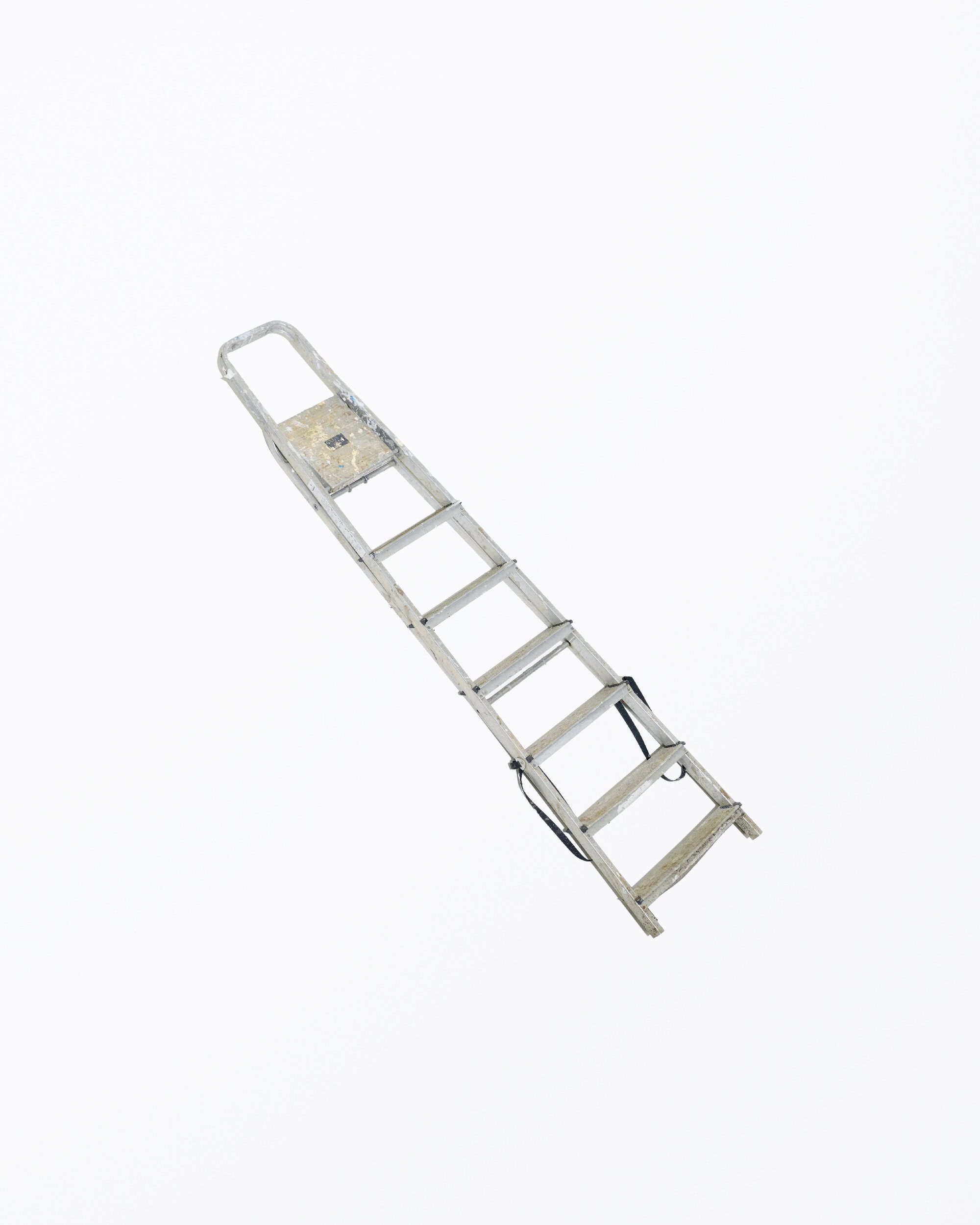 Angled view of an aluminum step ladder, featuring six steps and a handle, set against a clean white background. The image is brightly lit.