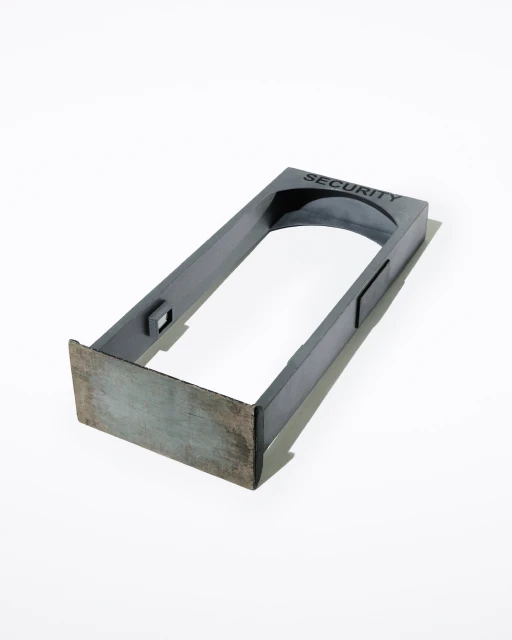 Metal frame security barrier. Gray metal rectangular gate structure with 'SECURITY' in black letters at the top center.