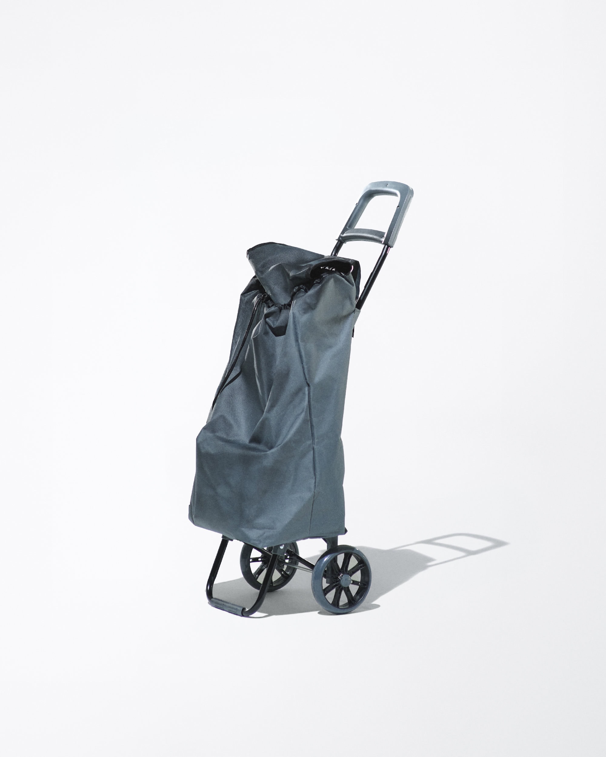 Studio shot of a gray rolling shopping cart with a handle. The bag has a drawstring closure. The background is bright white.