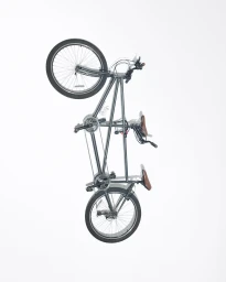 Studio shot of a tandem bicycle viewed from above, resting against a seamless white background.
