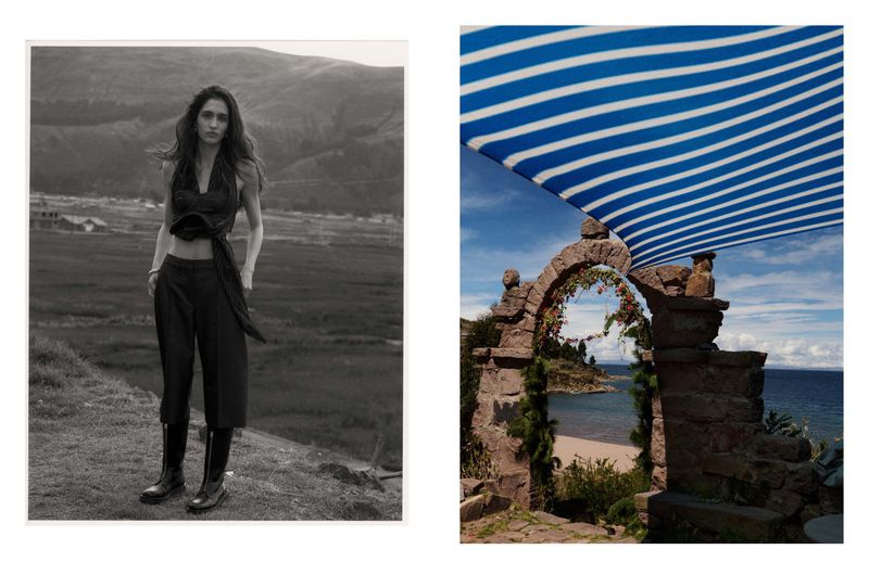 Monochrome portrait of a woman in a rural landscape; stone archway with striped canopy, distant sea view under a bright sky.