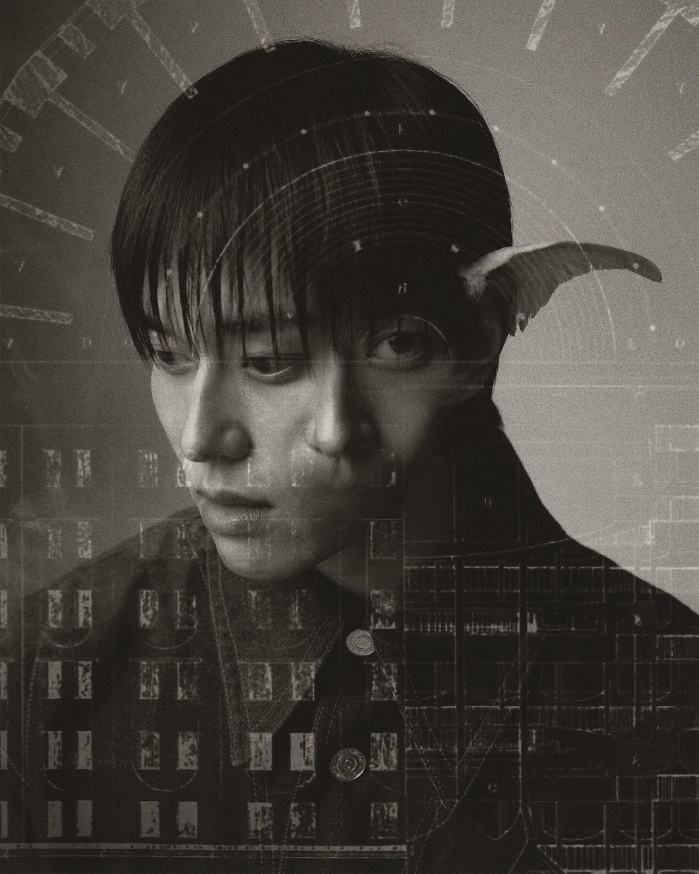 Monochrome portrait of a young adult man with artistic double exposure of building facade and clock face creating a surreal effect.