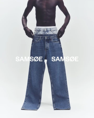Dark-skinned male torso modeling two pairs of blue jeans in a bright photo studio; Samsøe Samsøe brand text visible.