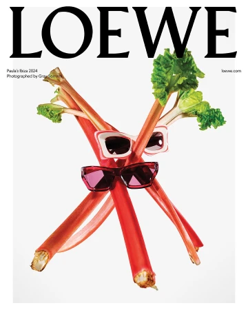 Loewe campaign image features rhubarb stalks crossed with sunglasses against a white backdrop, showcasing a high-fashion eyewear concept.