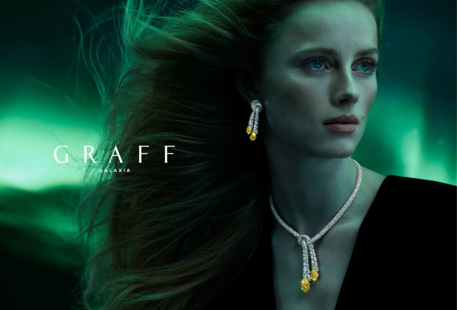 Stunning close-up of a fair-skinned woman wearing a diamond necklace and earrings against a blurred green background, jewelry advertisement.