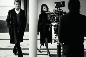 Brad Pitt and Penelope Cruz on set during the Chanel Iconic Handbag campaign in Deauville, France shot by Inez and Vinoodh.
