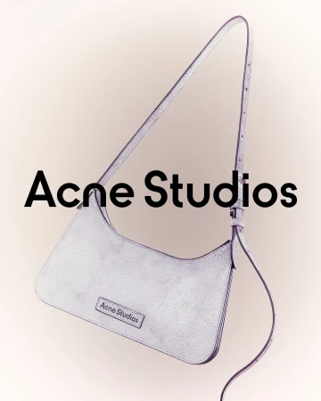 Acne Studios purse in a studio shot. Silver-toned leather purse with the brand logo shown on the front and in the backdrop.