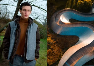 Man wearing a brown turtleneck, dark jacket, and grey puffer vest outdoors next to an aerial view of a winding blue track.