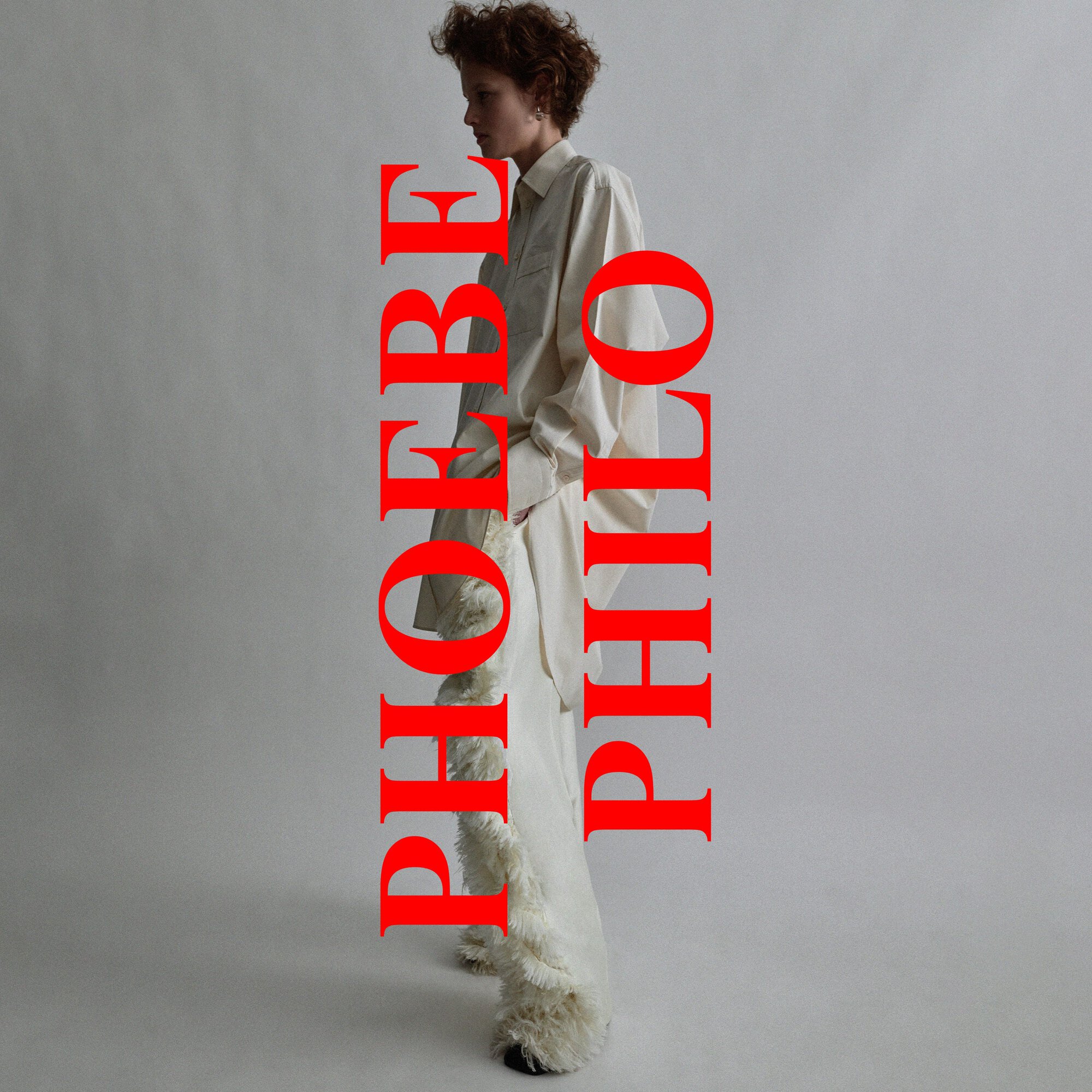 Fashion shot of a woman in white dress against a gray background with red text overlay. Minimalist aesthetic, studio lighting.