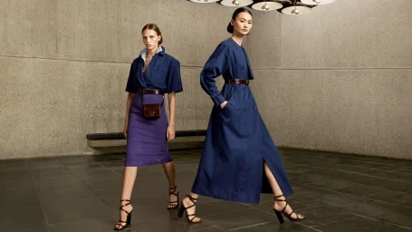 Two models wearing blue outfits and strappy heels posing inside the Breuer building for Max Mara Spring 2024 campaign