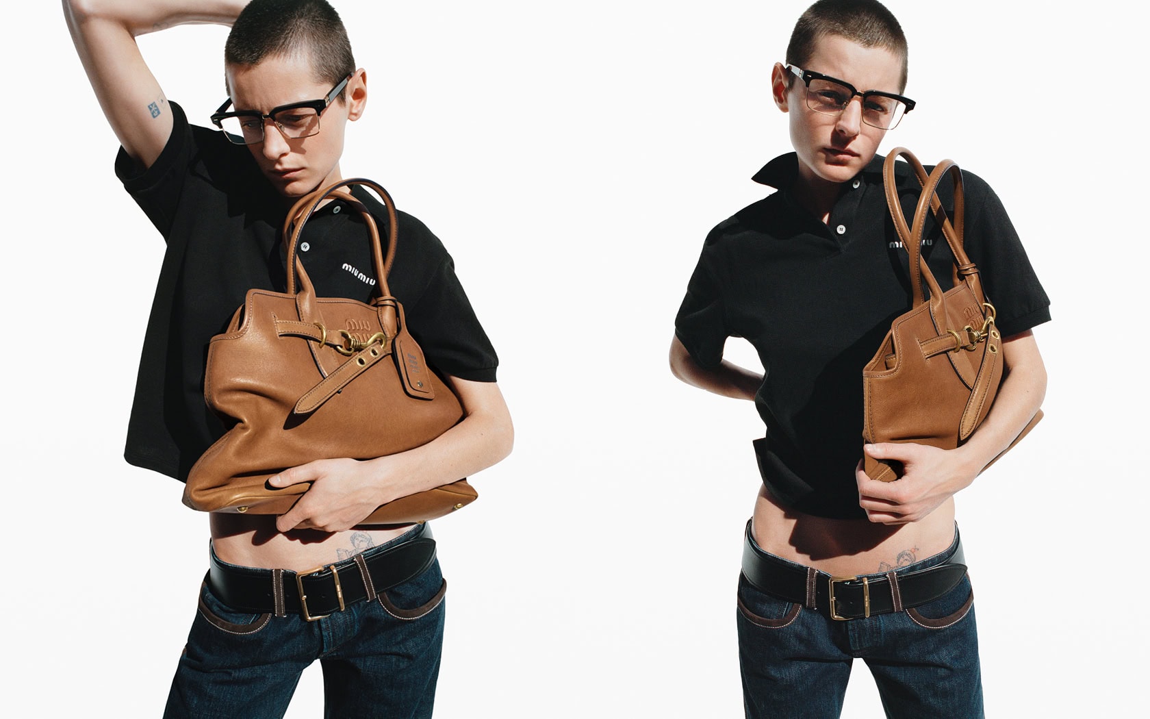 Fashion shot of two young adults in black polo shirts and jeans holding tan leather handbags against a plain white backdrop.