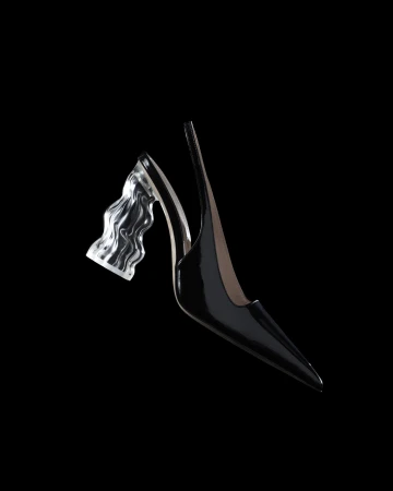 Elegant black slingback heel featuring a transparent, sculpted heel, set against a stark black backdrop. Fashion-forward footwear.