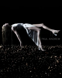 Model Abby Champion levitating horizontally in a white dress over a field of lights for Paul Andrew by photographer Jet Swan
