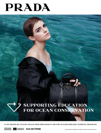 Emma Watson poses with a Prada bag against a vibrant teal ocean backdrop in a fashion advertisement promoting ocean conservation.