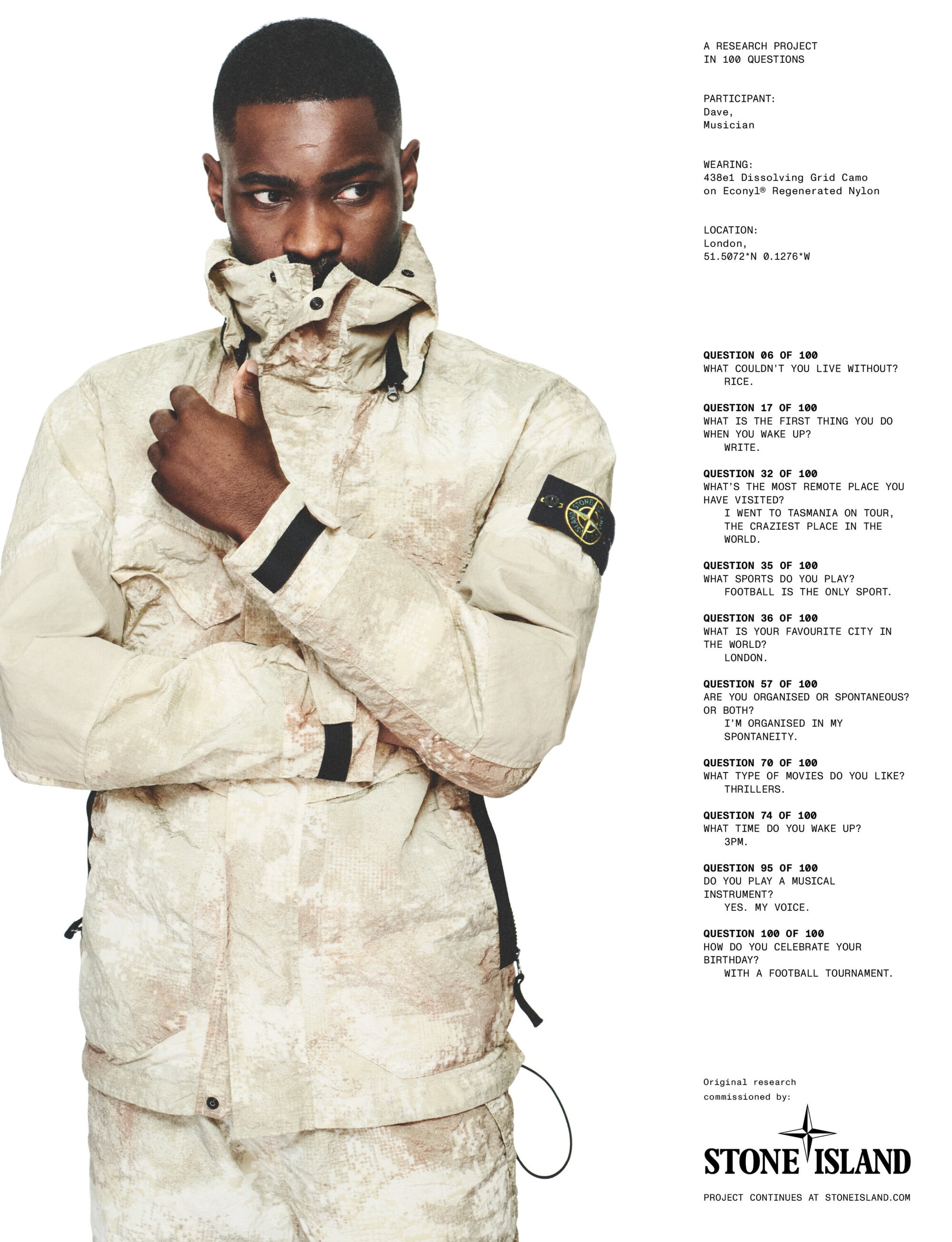 A man in a patterned jacket stands next to a white background with printed questions and Stone Island logos, creating a modern editorial style.