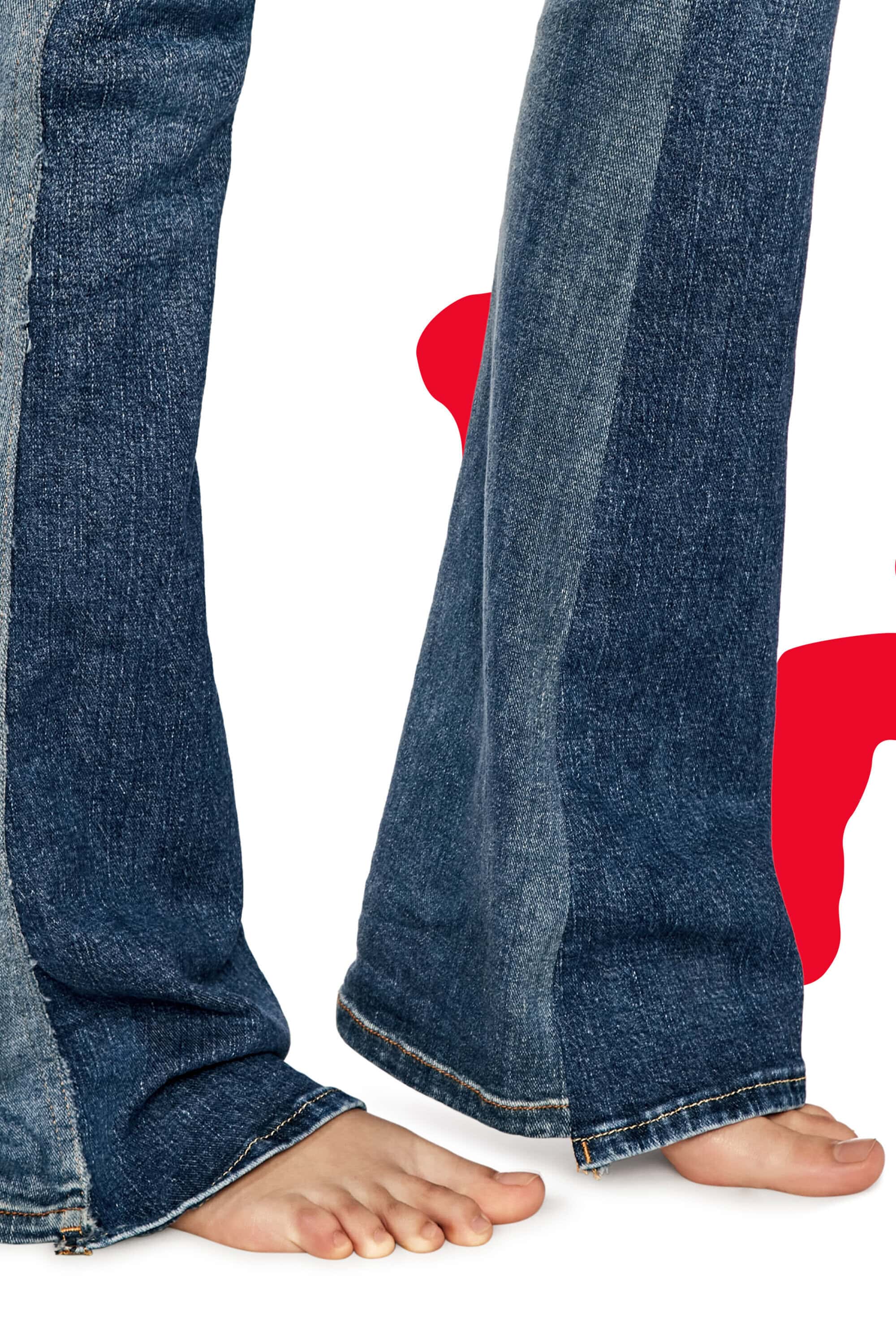 Cropped image of blue denim jeans and bare feet against a white background with a partial red shape adding a modern and casual style.