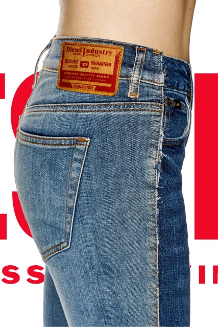 Close-up studio shot of jeans with a leather patch. The left side is light blue denim, the right side is dark blue denim.