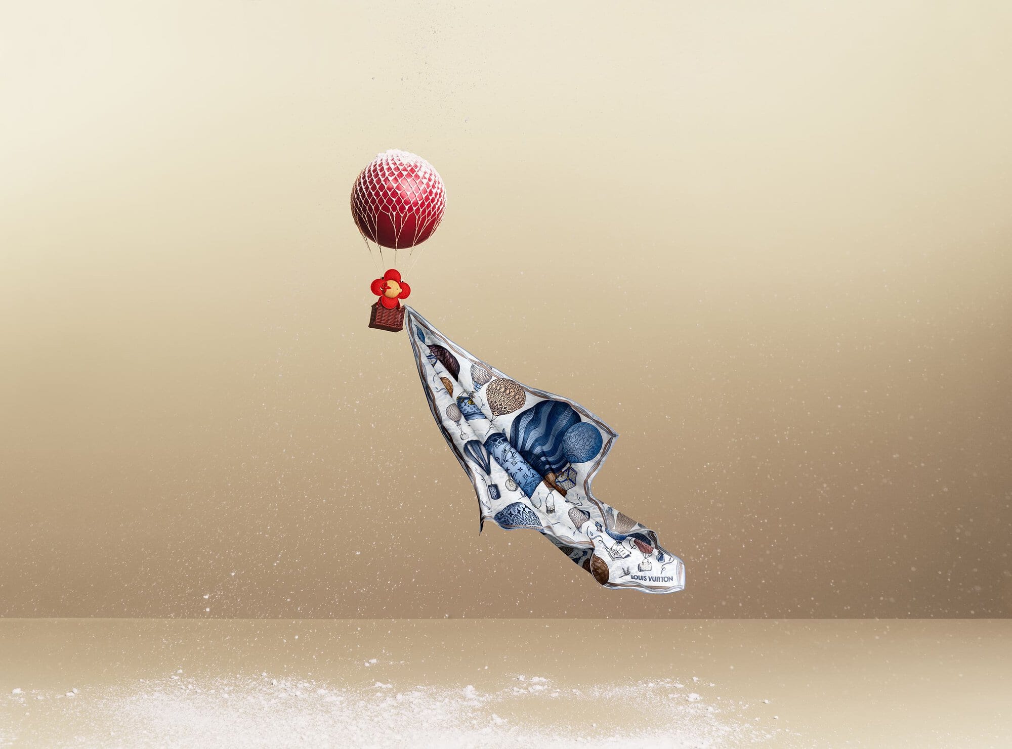 Stylized product shot of a patterned Louis Vuitton scarf attached to a red balloon, against a gradient tan background with scattered particles.