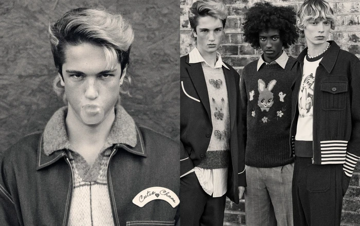 Monochrome fashion campaign image featuring three young male models wearing patterned sweaters and jackets against a brick wall.