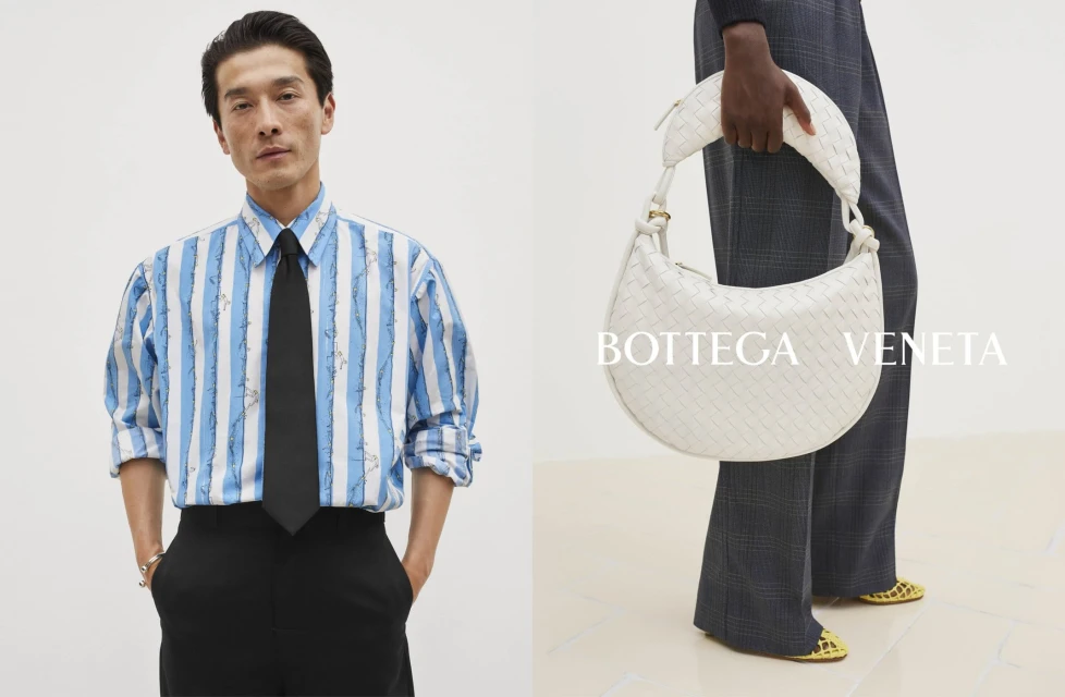 Fashion shot featuring an adult male in a striped shirt with a tie, and a woman holding a Bottega Veneta white woven leather purse.