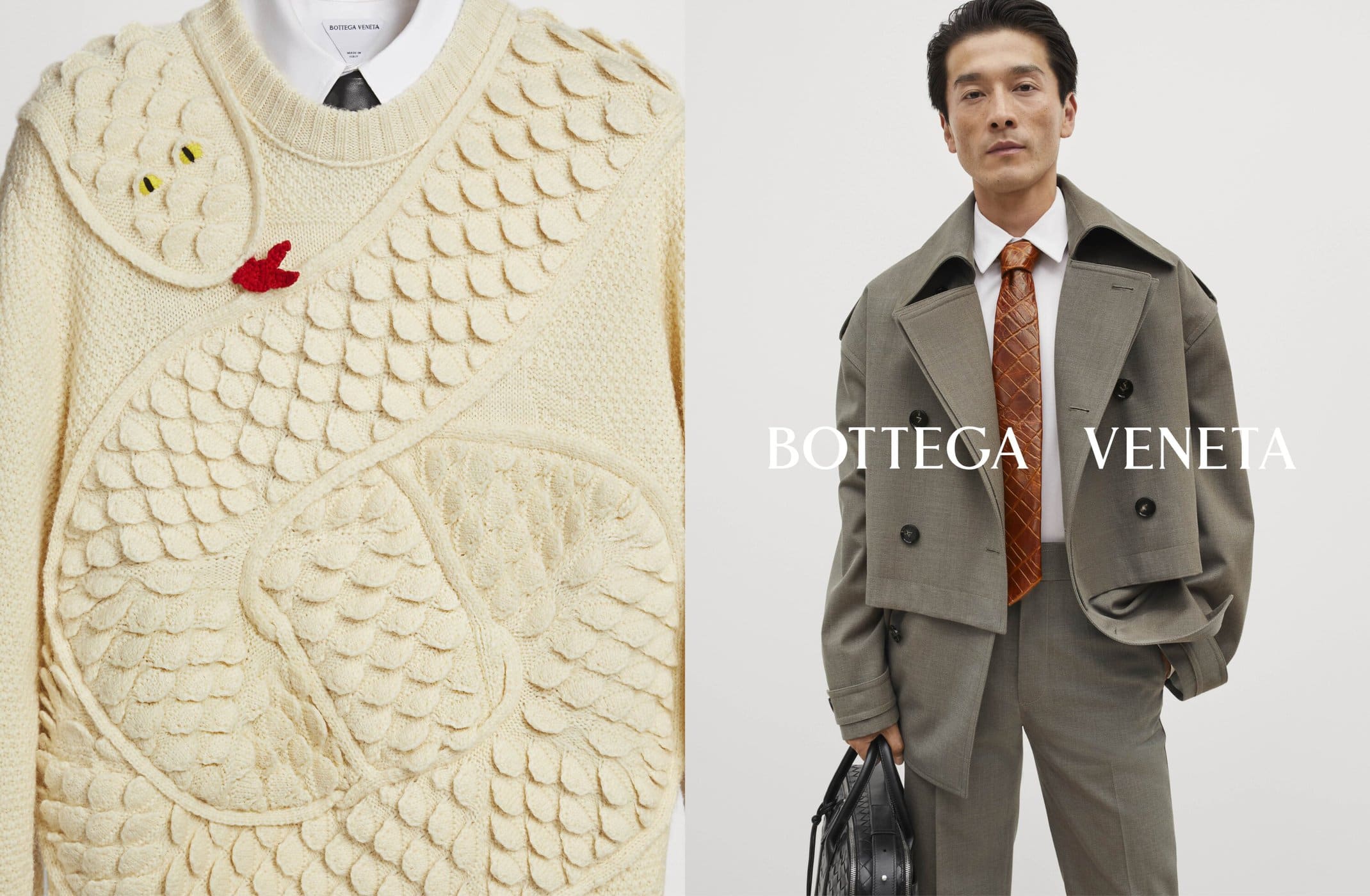 Fashion editorial shot showcasing a man in a grey suit with an orange tie and a sweater featuring a snake design against a clean backdrop.