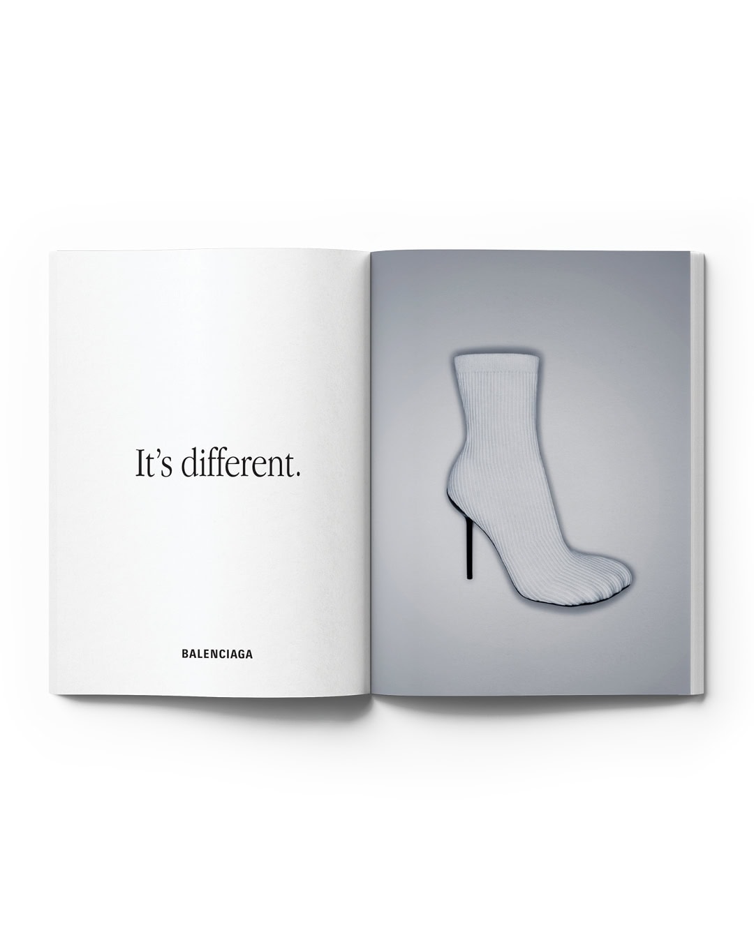 Sock-shaped high heel shoe featured in magazine advertisement for Balenciaga. Page also includes the brand's name and tagline.