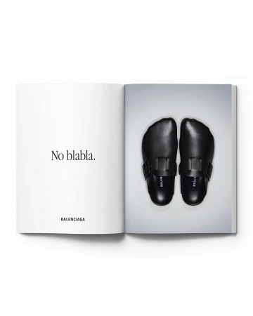 Open magazine featuring a pair of black Balenciaga clogs on a light grey background, with the text "No blabla" and the brand name.