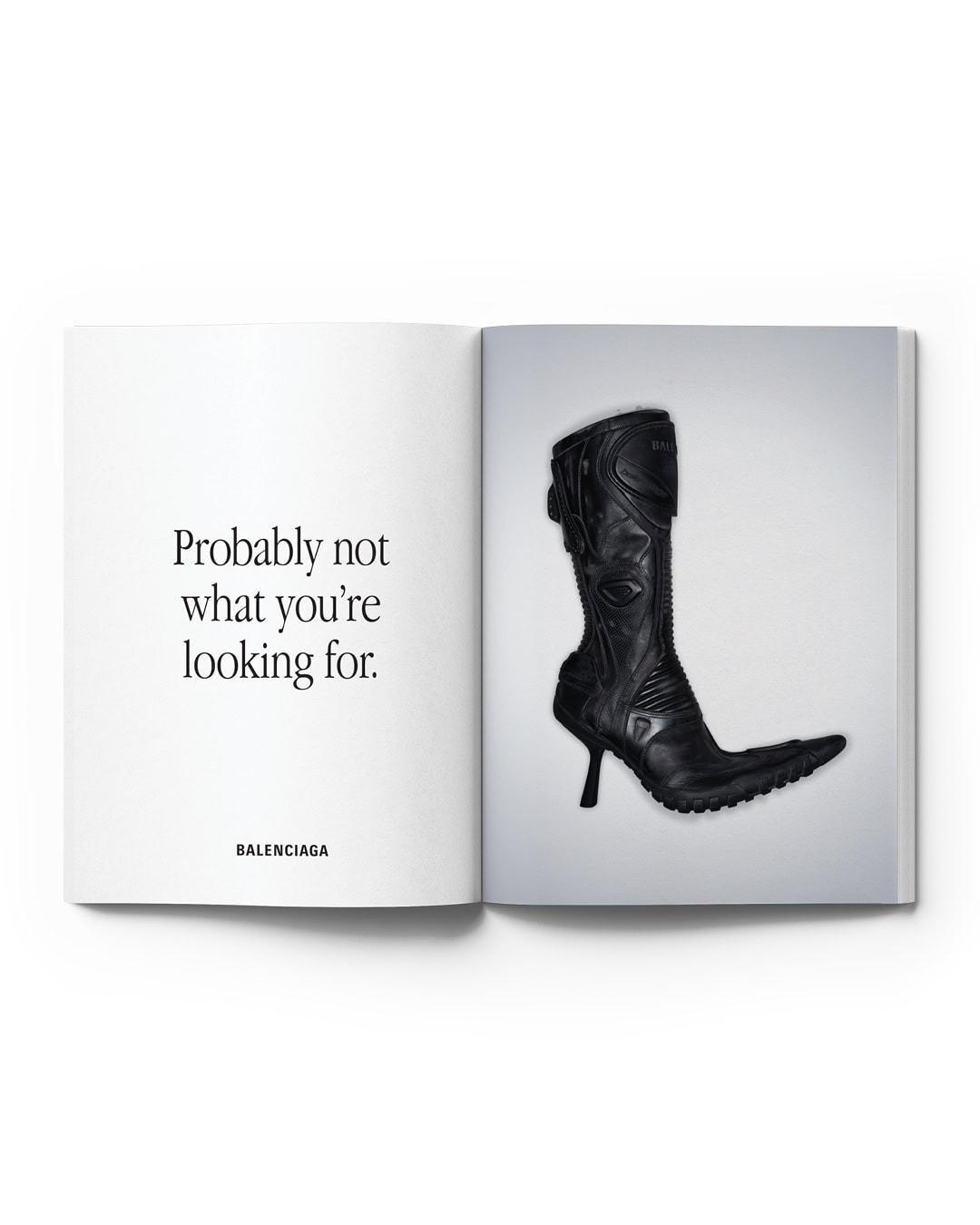 Black leather high-heel boot displayed on a page of an open magazine with a white background and the text 'Probably not what you're looking for'.