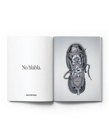 Open magazine featuring a gray Balenciaga sneaker on the right page and the text 'No blabla' and 'BALENCIAGA' on the left.