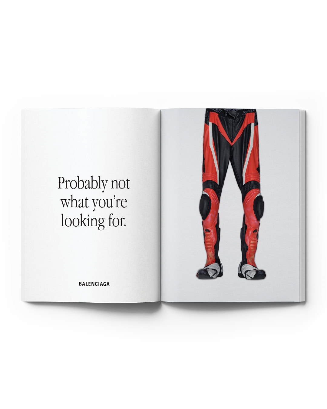 Open book features fashion brand ad, displaying red & black motorcycle pants and the phrase, 'Probably not what you're looking for'.