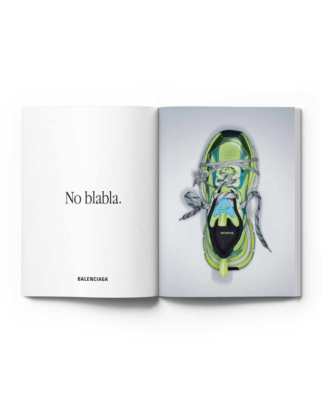 Open magazine featuring a lime green Balenciaga sneaker with blue accents, laces, and a thick sole, presented against a white background.