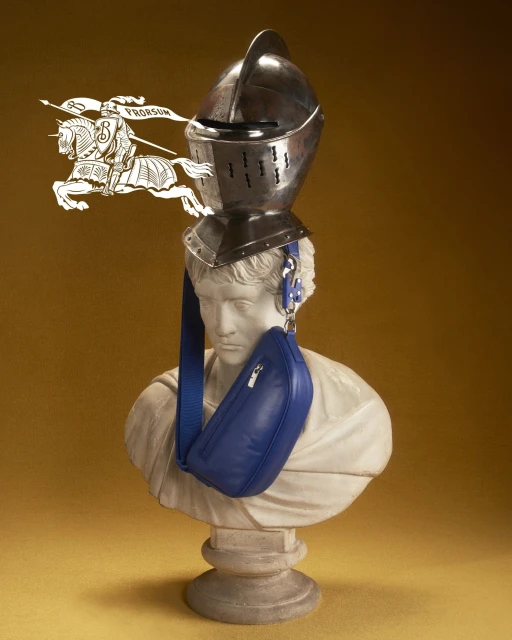 Bust with a medieval helmet and a blue bag in a studio setting with warm color grading and a logo of a knight on a horse.