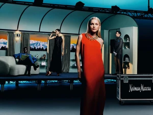 Models posed in an art-directed set resembling a luxury rail car with snowy mountain views for Neiman Marcus Holiday 2023.
