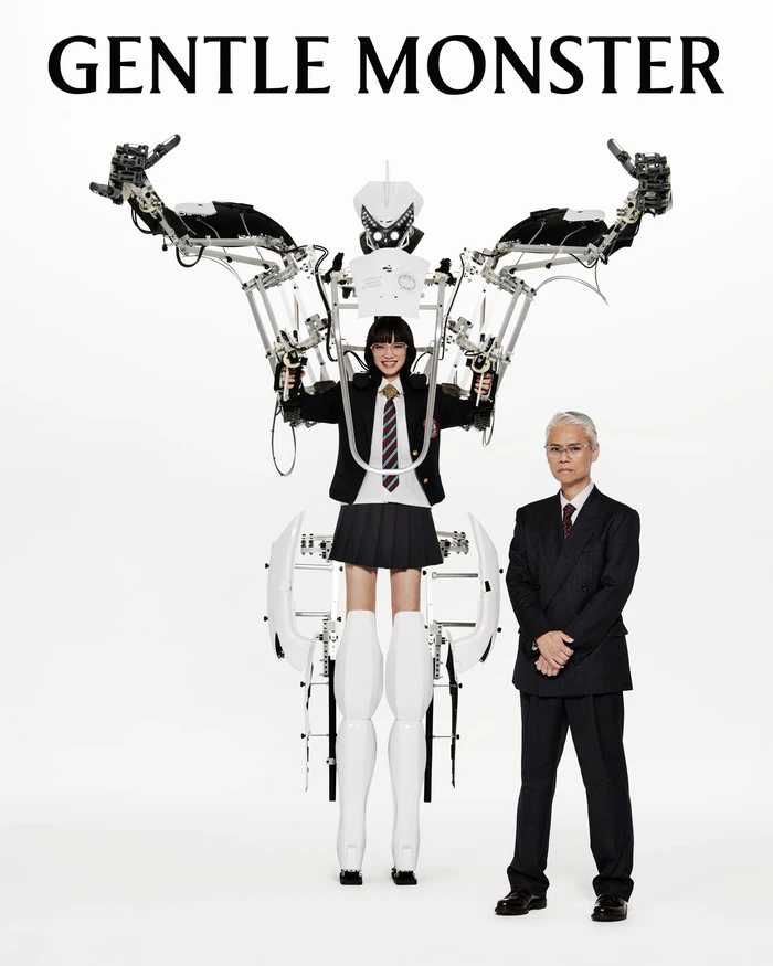 Nana Komatsu operating a mechanical exoskeleton rig alongside Shinichi Osawa for Gentle Monster Optical Campaign
