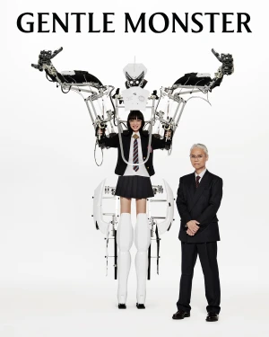 Nana Komatsu operating a mechanical exoskeleton rig alongside Shinichi Osawa for Gentle Monster Optical Campaign